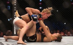 Ronda Rousey of the United States (R) and Holly Holm of the United States compete in their UFC women's bantamweight championship bout during the UFC 193 event