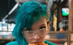 Teen eating pizza