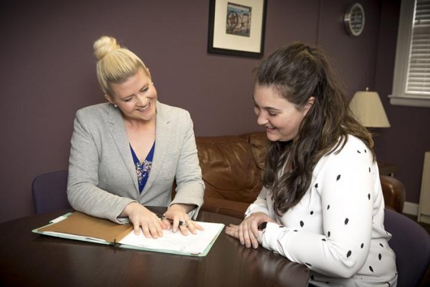 DIRECTOR OF THE ASPIRE CLINIC MEGAN FORD, LEFT, DISCUSSES A CASE WITH STUDENT PAIGE GARRISON. 