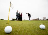 Researchers playing golf