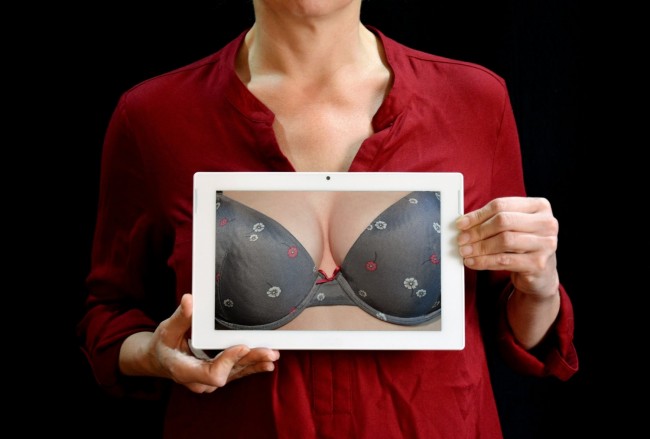 Woman Showing Tablet with Gray Bra